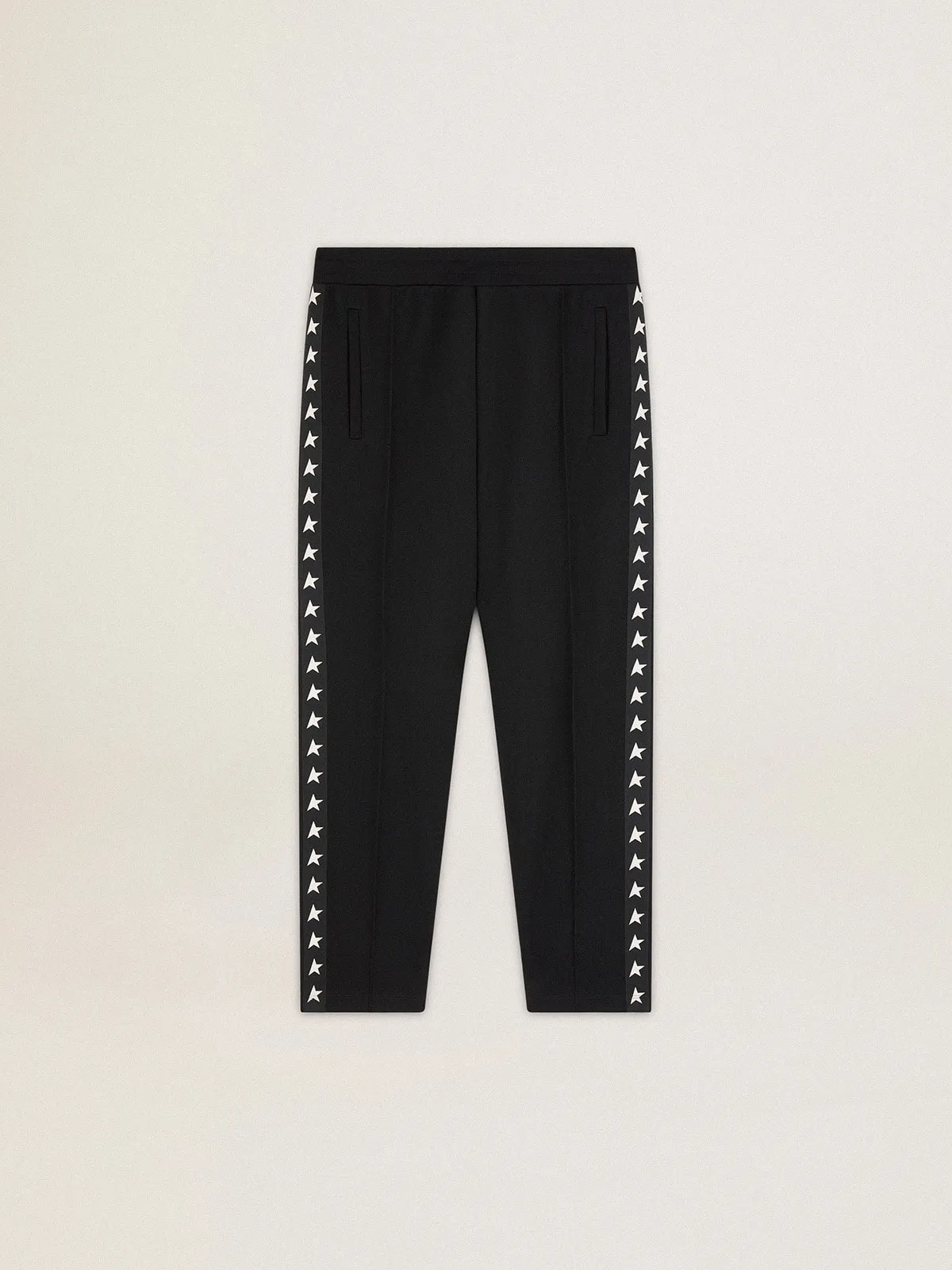 Men's black joggers with white stars on the sides