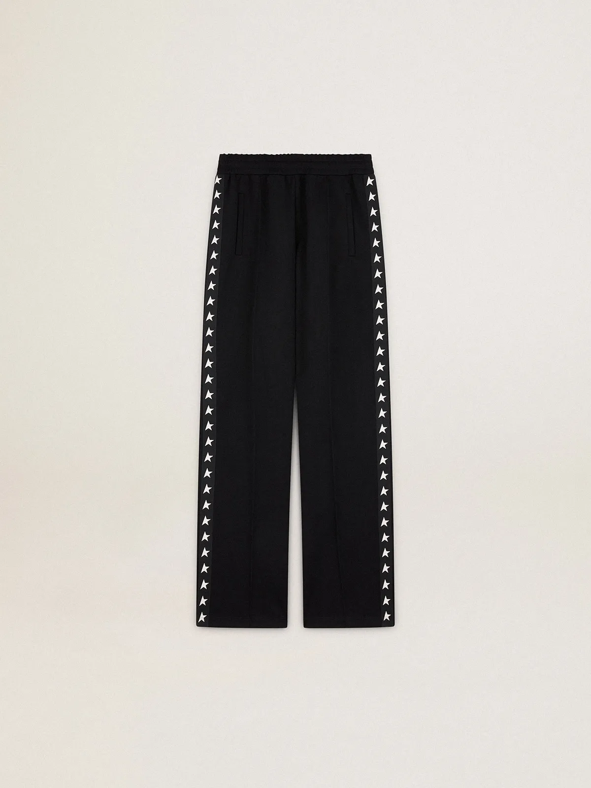 Women’s black joggers with white stars on the sides